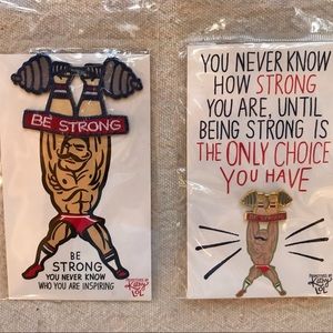 New set of 2, one cloth patch and one enamel pin, in packages. # Be Strong